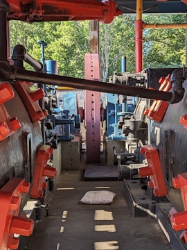 Factory scene showing vacuum compression packaging process for sofas.