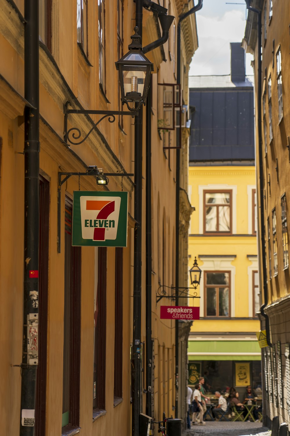 a street sign on a narrow city street