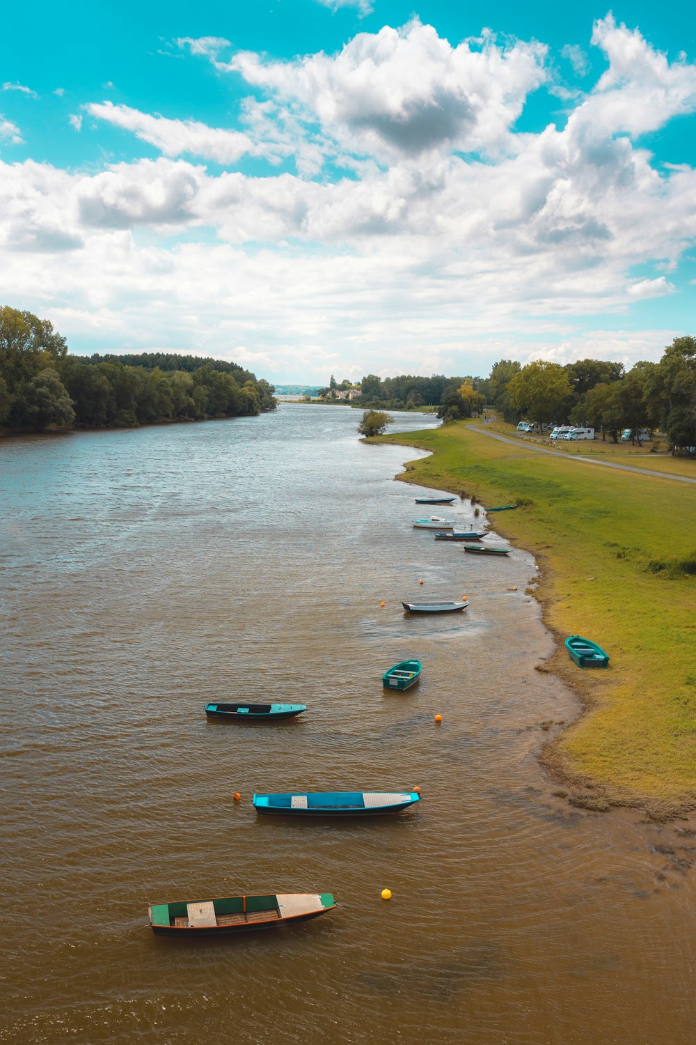 a group of boats floating on top of a river