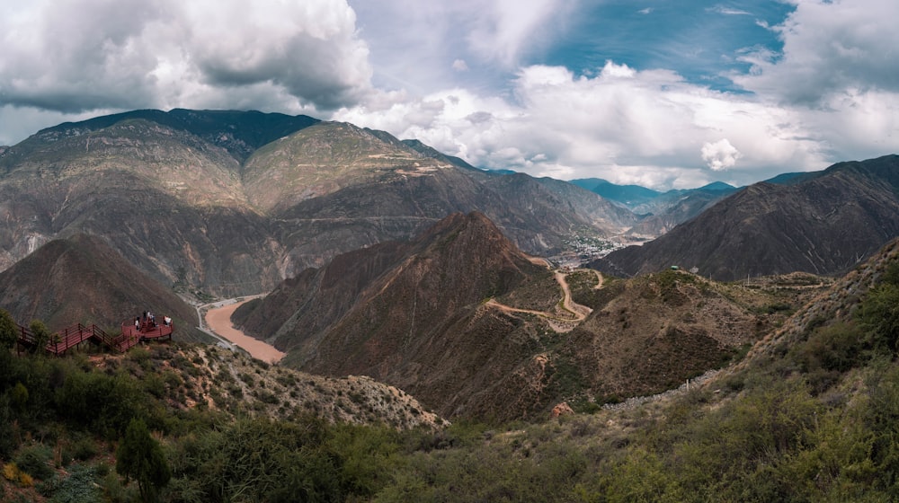 a scenic view of mountains and a road