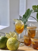 Refreshing iced tea served in a tall glass with lemon slices and ice cubes.