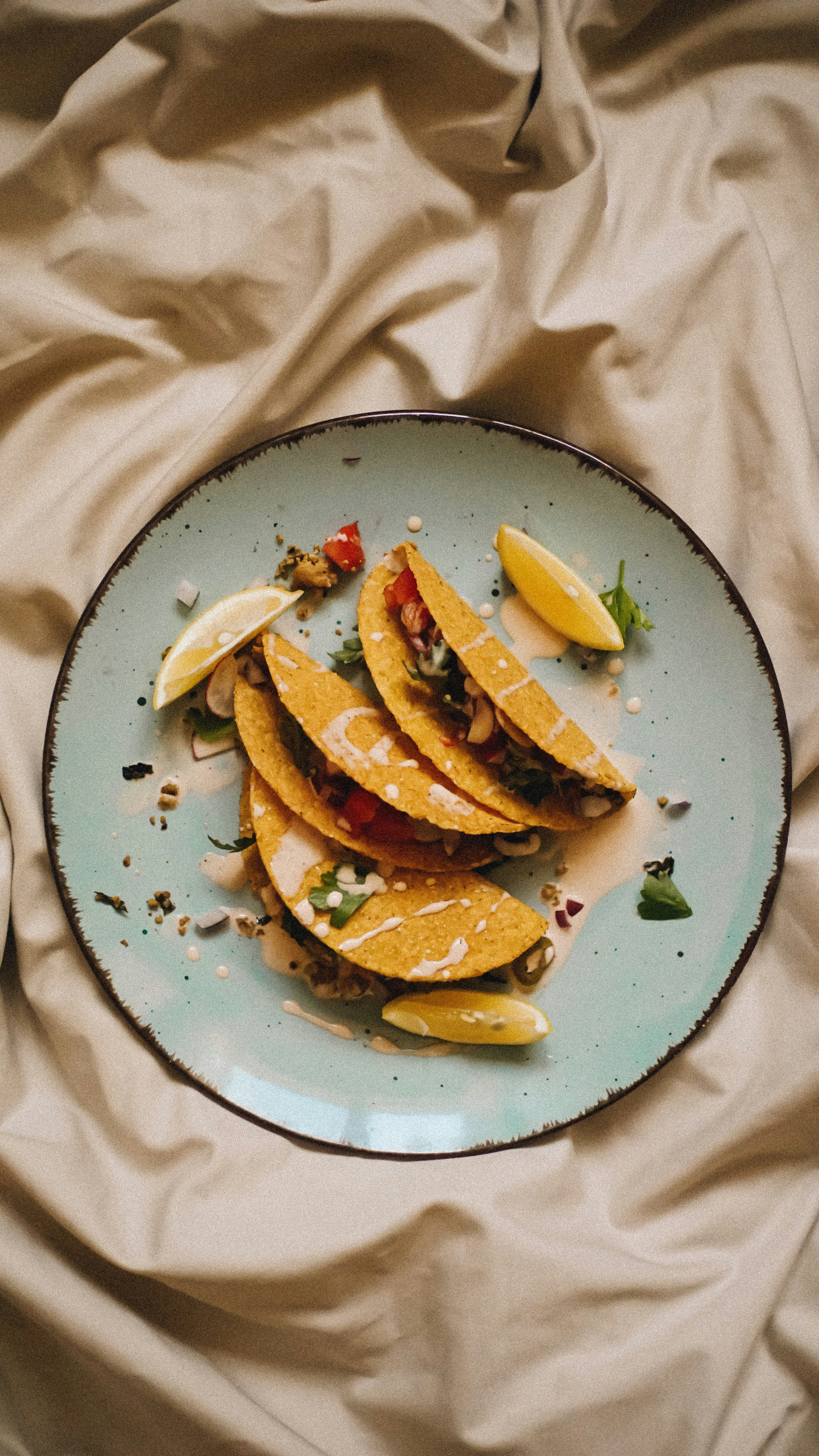 A vibrant plate of fresh fish tacos with lime