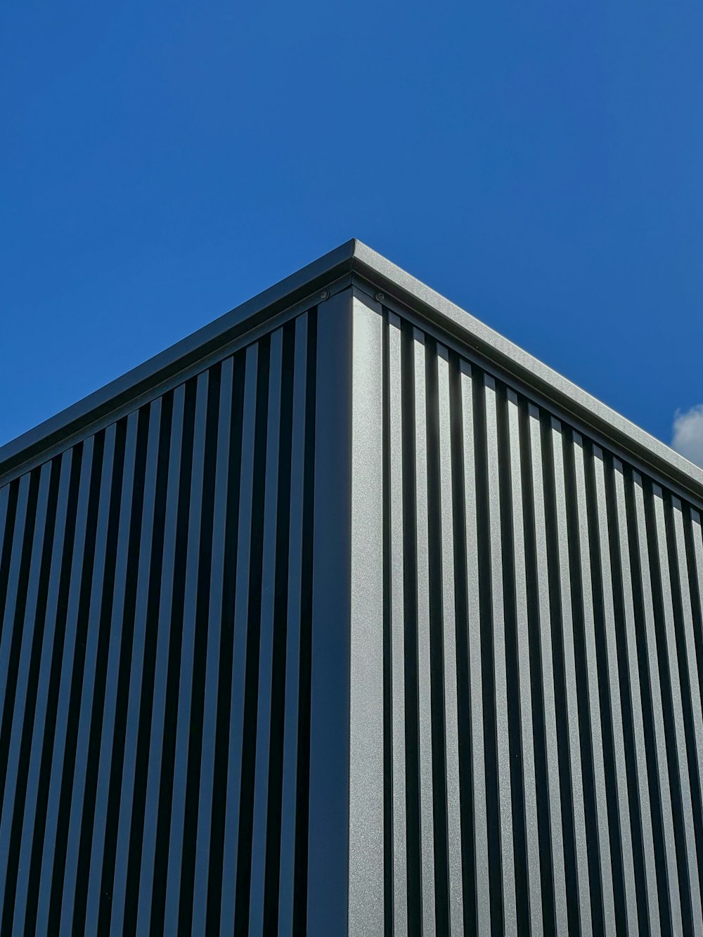 a tall building with a sky in the background