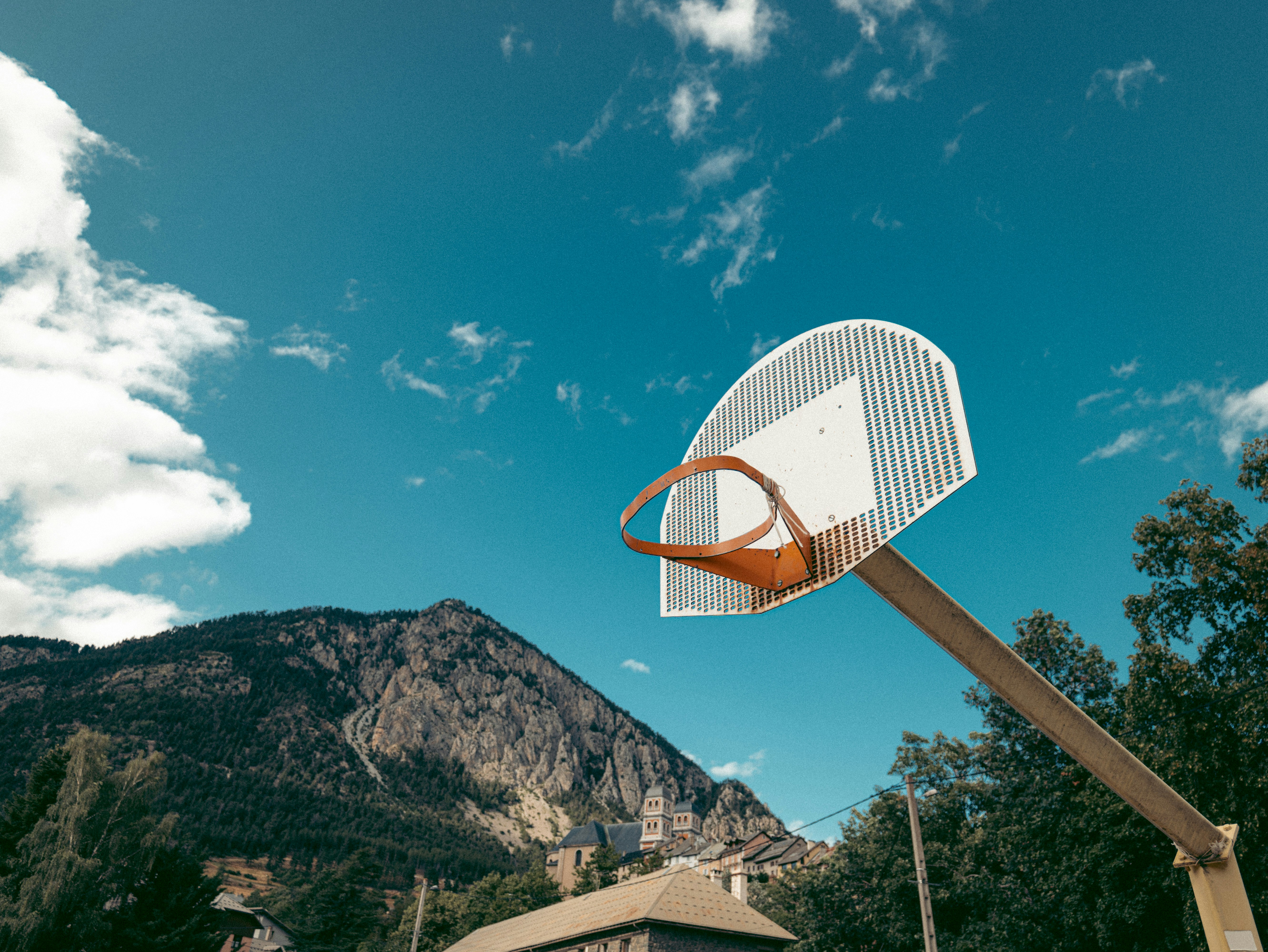A basketball hoop in front of a mountain photo Free Basketball Image