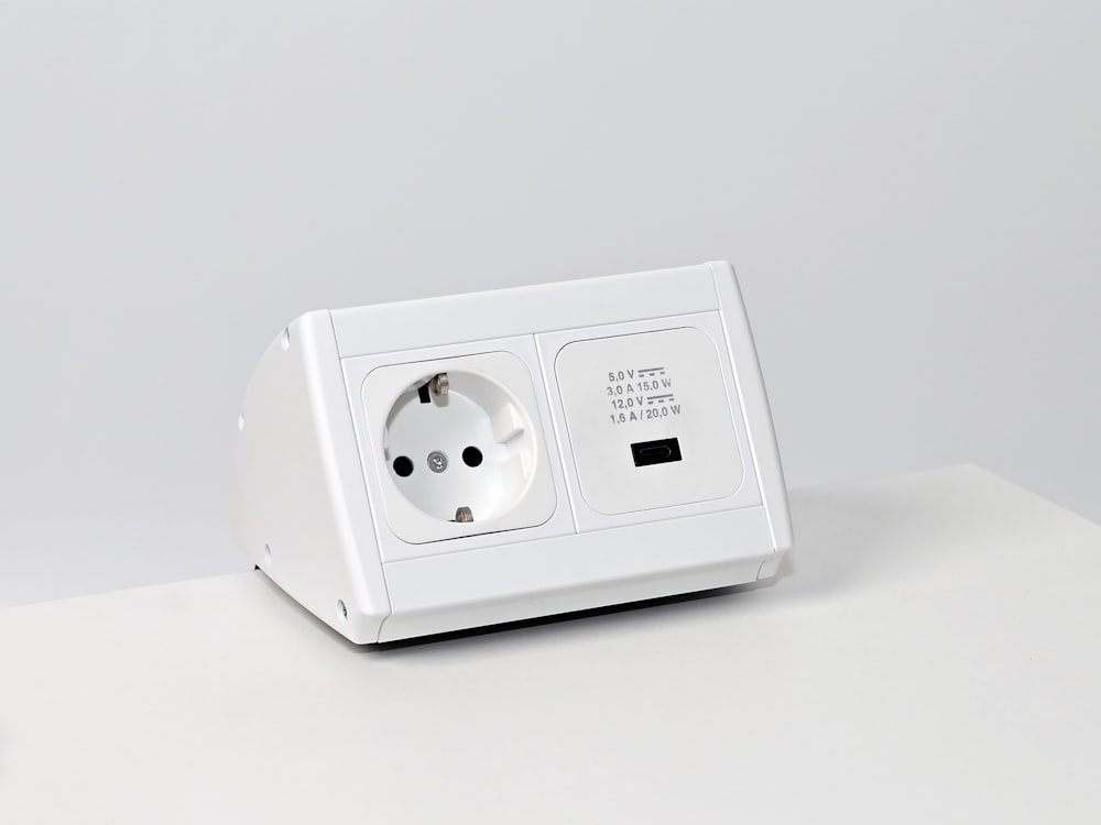 a white electrical outlet on a white surface