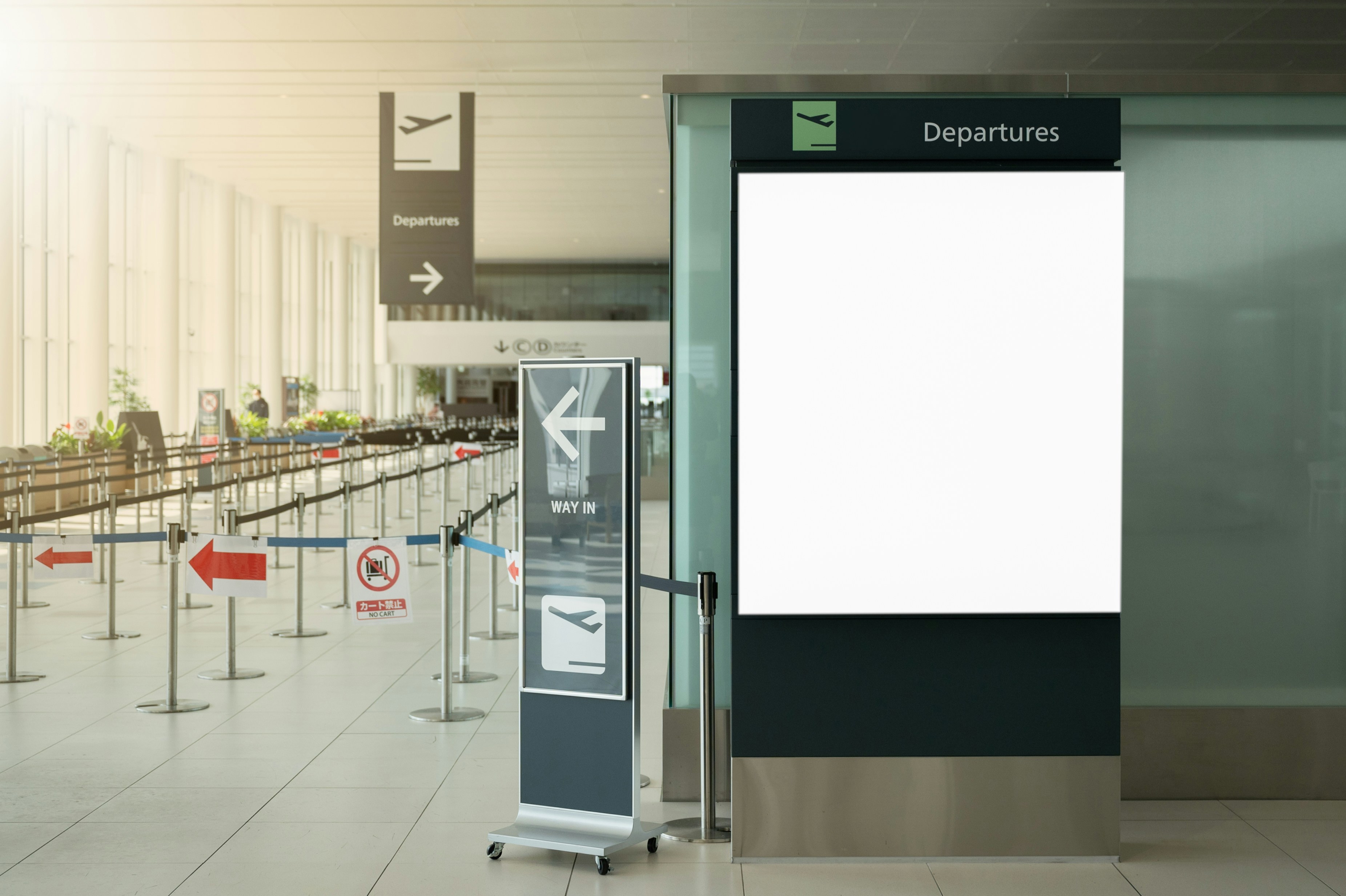 an empty airport terminal with a sign for departure