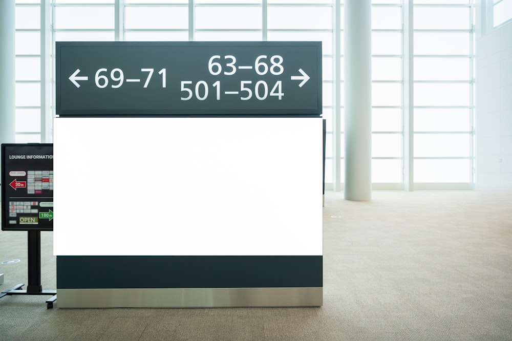 a sign in an airport showing the time of departure