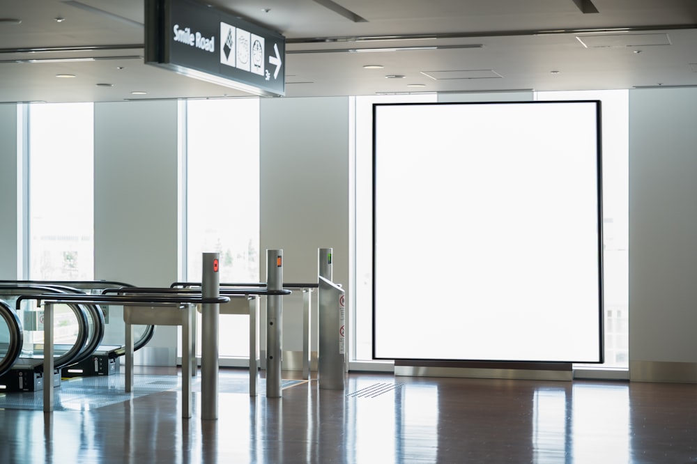 an empty airport waiting area with chairs and luggage