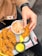 A happy customer enjoying a meal prepared with Kemsyl's chicken.