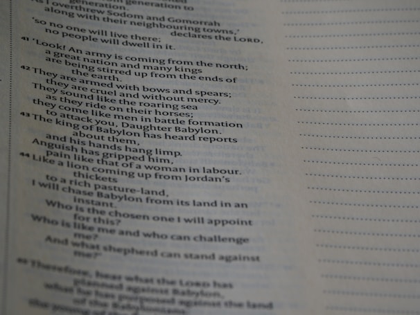 Close-up of a page from a printed book. The text is in English and appears to be a passage discussing various subjects related to a great army attacking Babylon. The page is well-lit, with the text predominantly in black on a white background. The right side of the page features a dotted line pattern.
