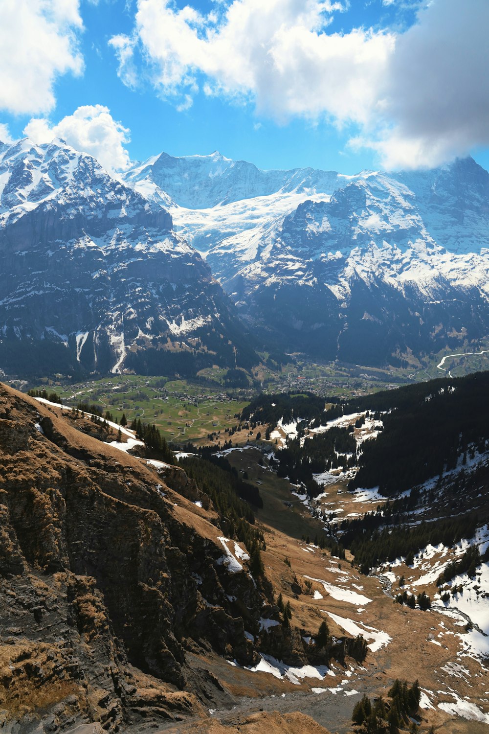 a view of a mountain range with snow on the mountains