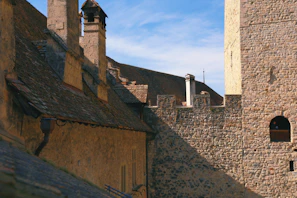 Old stone walls of Cunziria village bathed in warm morning light