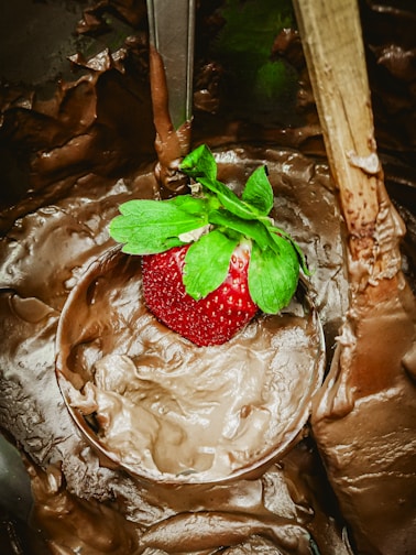 Close-up of fresh strawberries dipped in rich, glossy chocolate with delicate drizzles.
