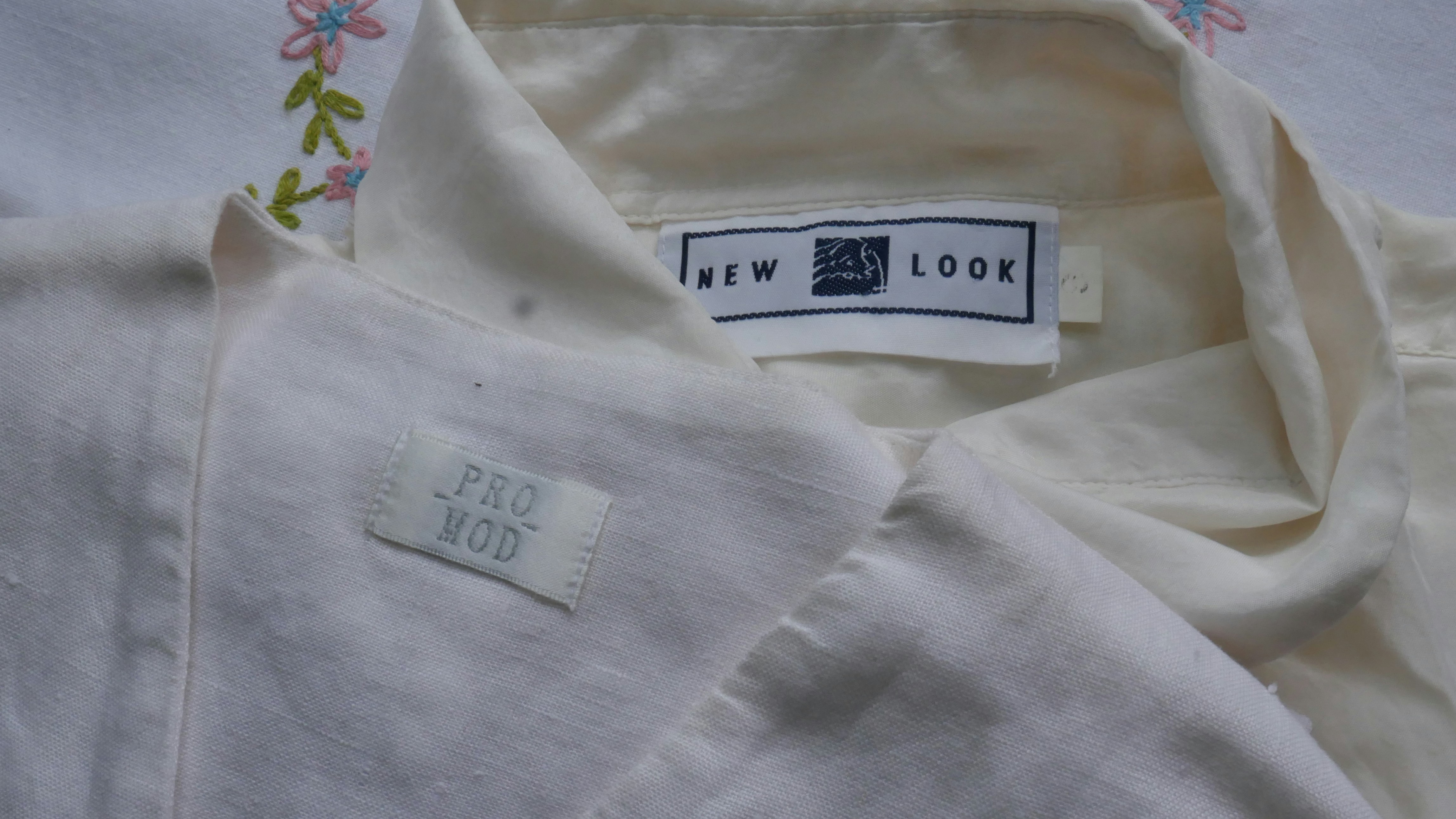 a close up of a label on a white shirt