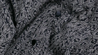 Close-up of a digital clothing pattern displayed on a computer screen in a modern studio