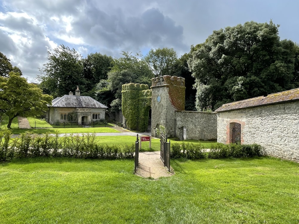 a stone building with a gate in front of it