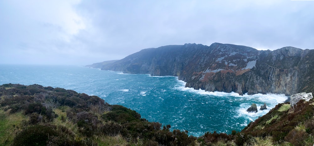 a view of the ocean from the top of a mountain