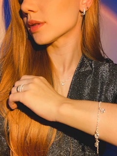 a close up of a person wearing a bracelet