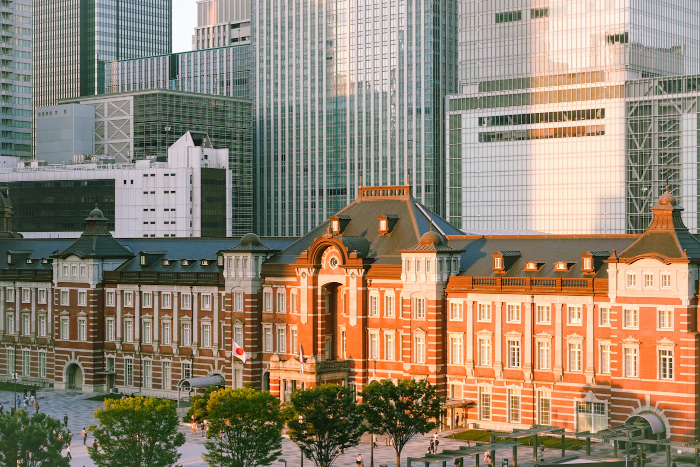 The red-brick facade of Tokyo Station in warm evening light