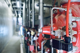 a close up of pipes and valves in a building