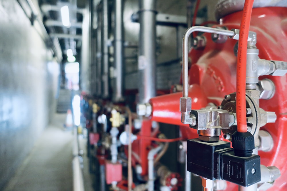 a close up of pipes and valves in a building