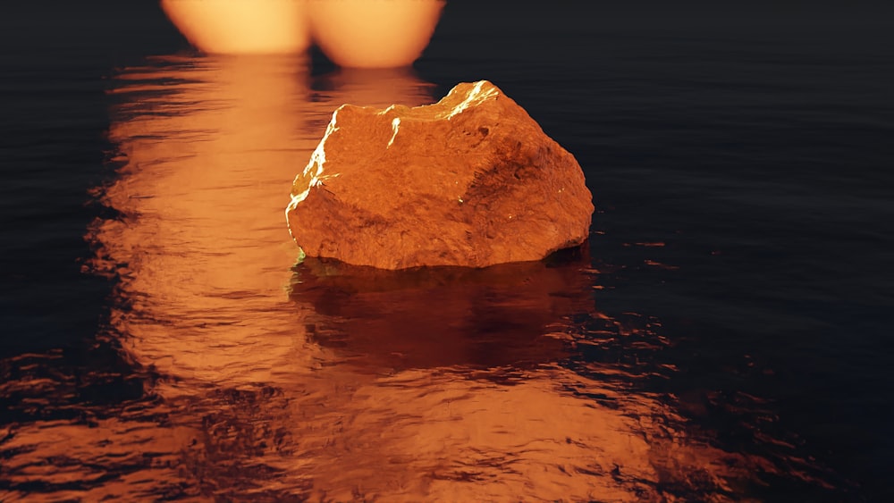 a large rock in the middle of a body of water