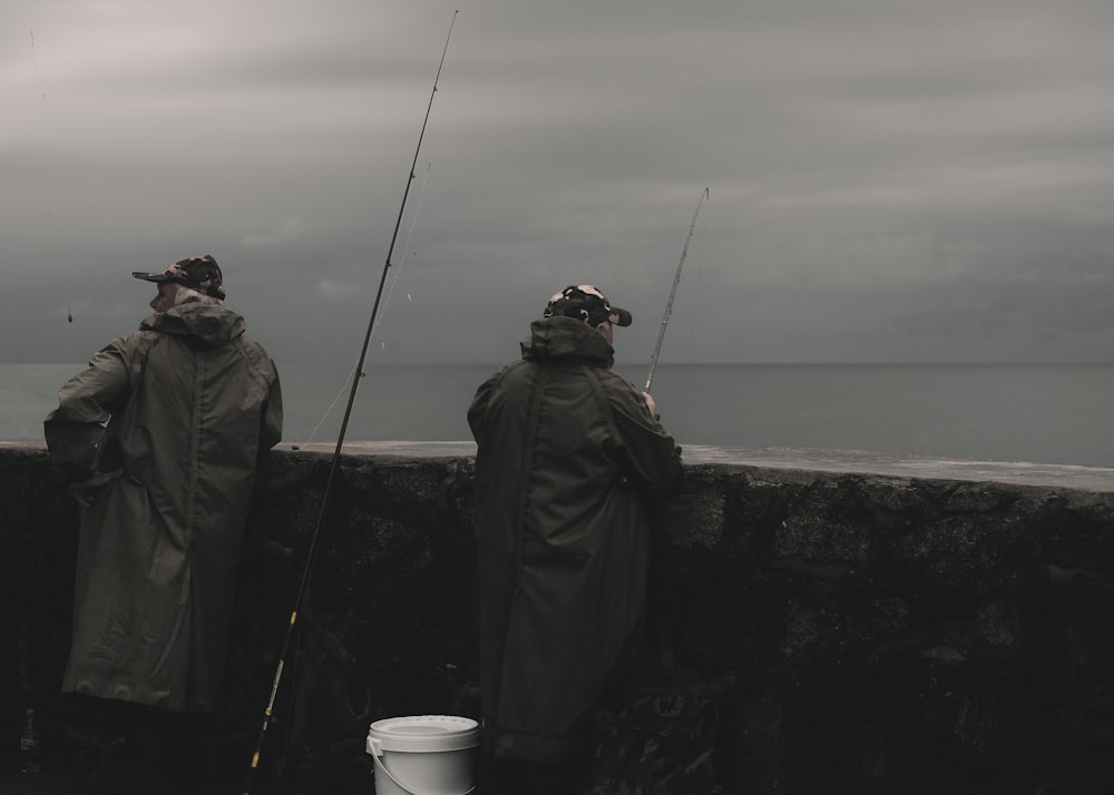 a couple of men standing next to each other