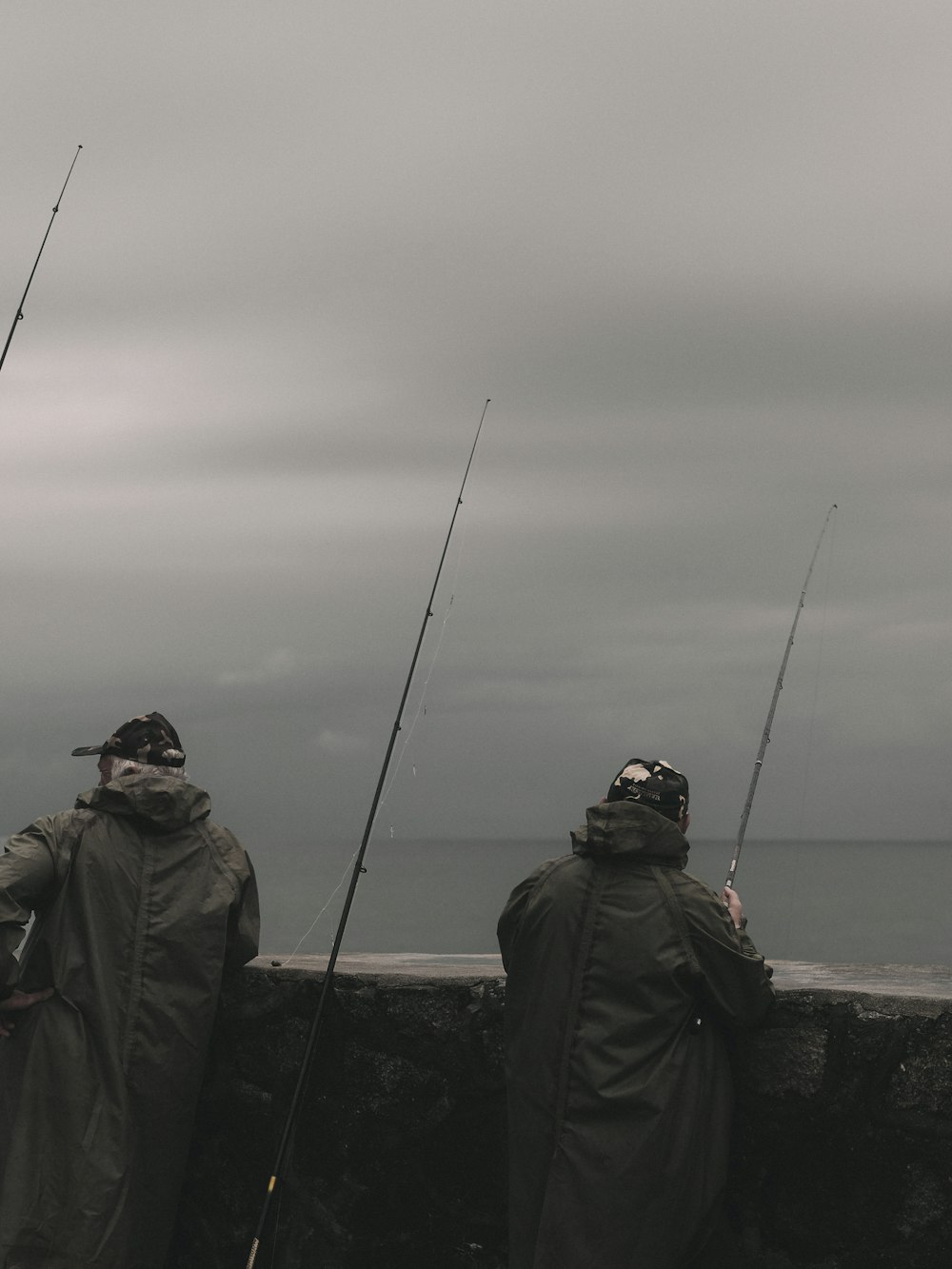 a couple of men standing next to each other