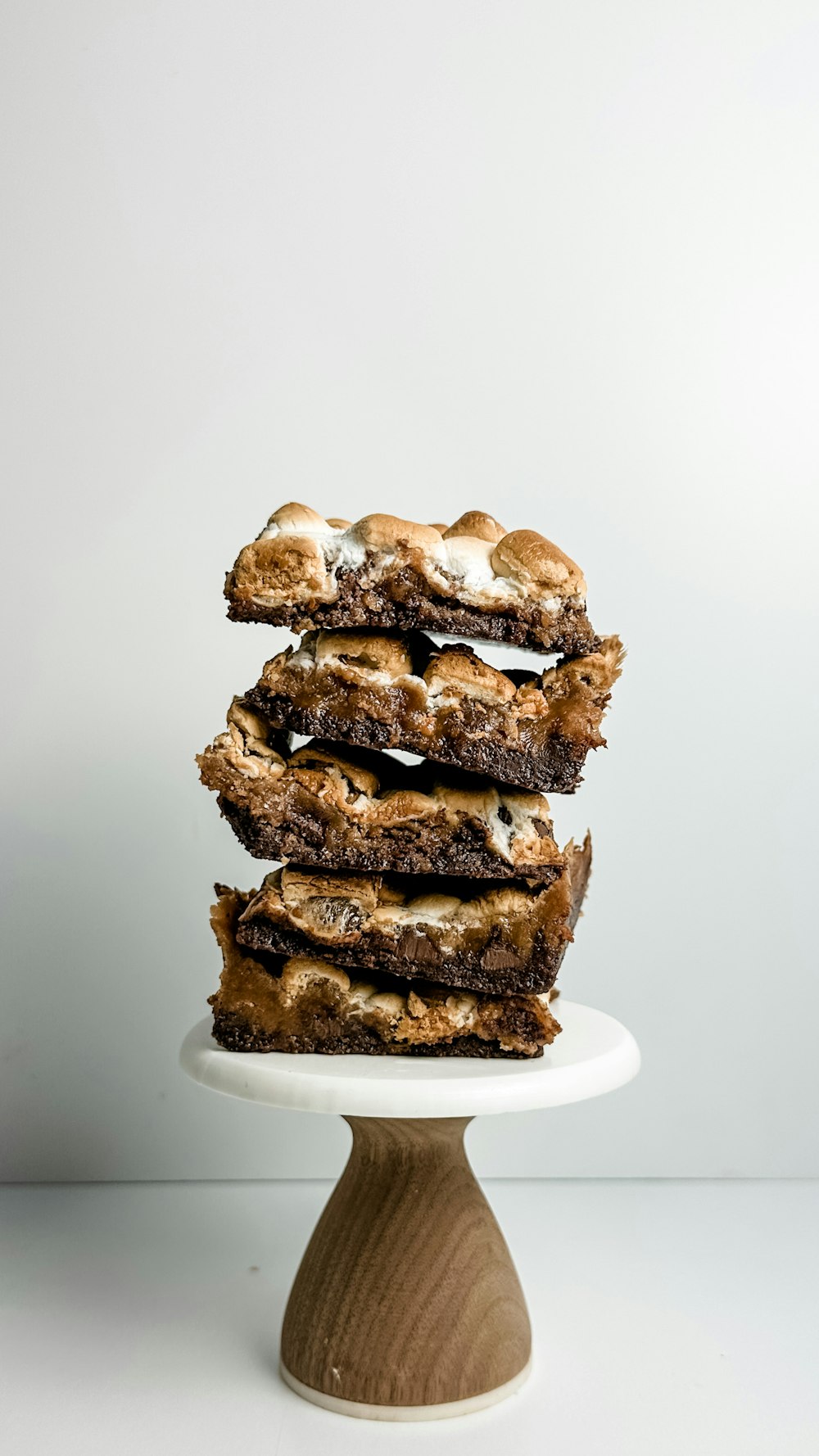 a stack of cookies sitting on top of a white plate