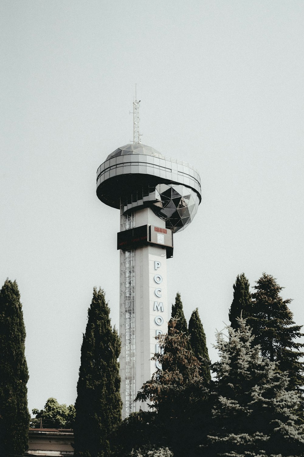 a tall tower with a clock on the top of it