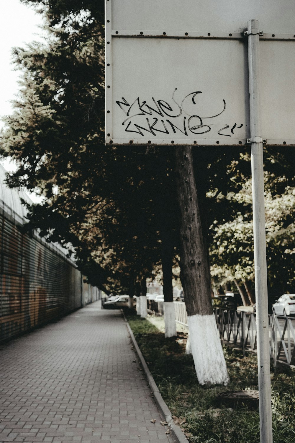 a street sign that has graffiti on it