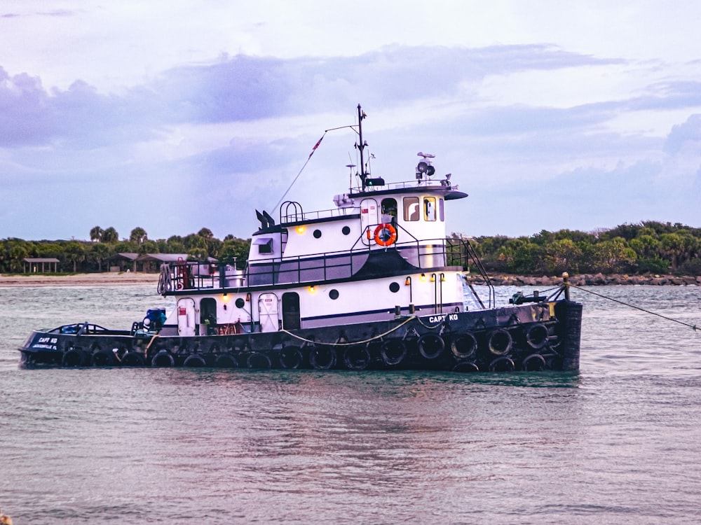 a large boat floating on top of a body of water