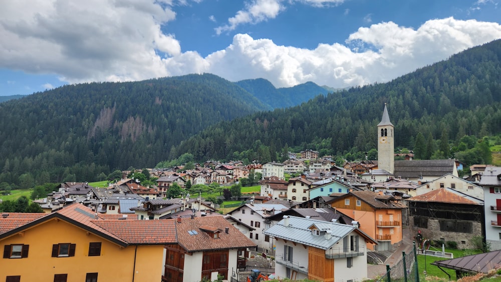 a small town with a steeple in the background