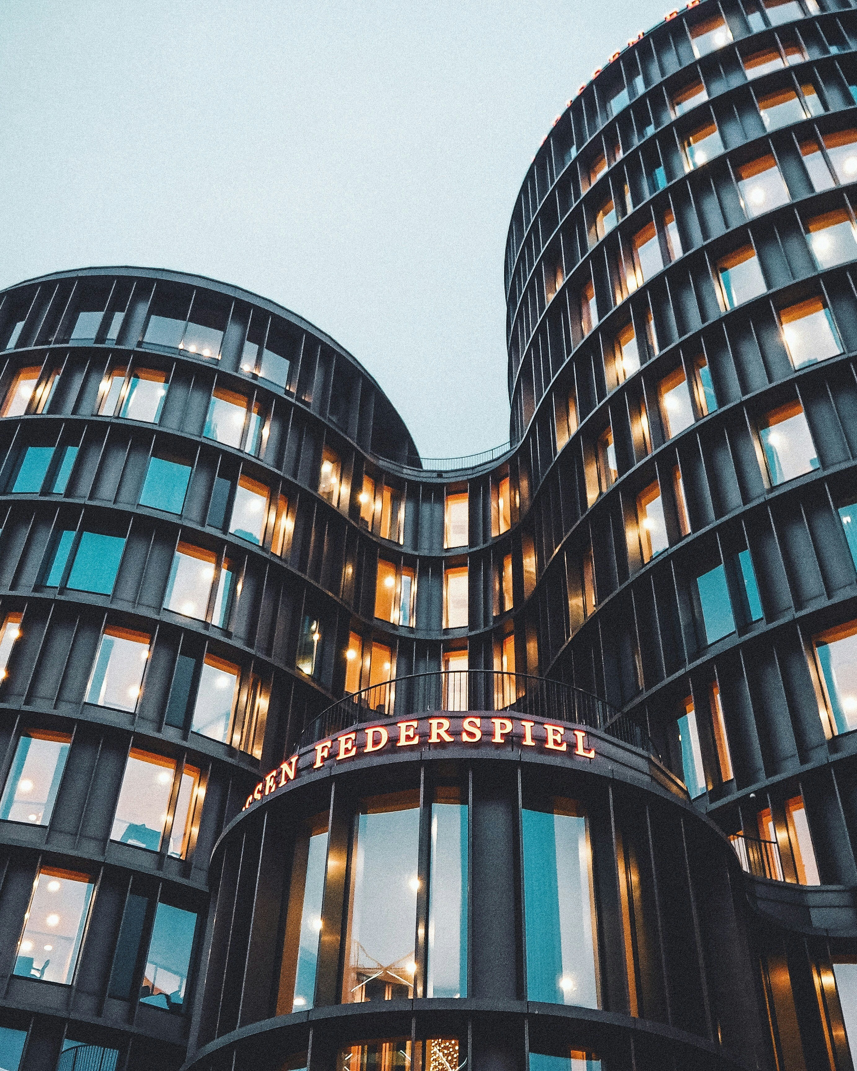 a tall building with a sign on top of it