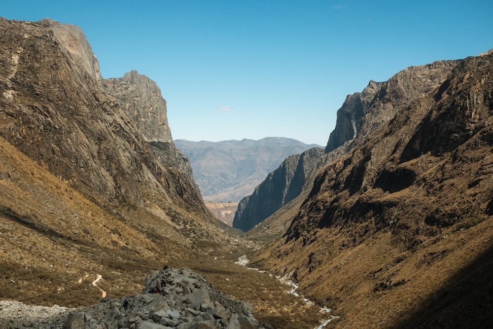 a view of a valley with mountains in the background