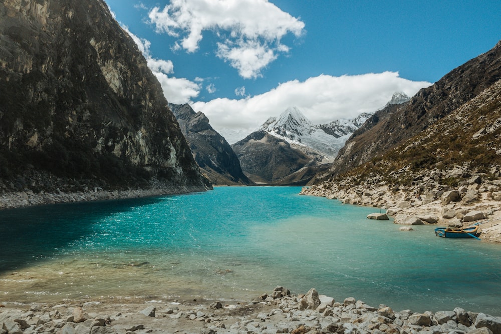 a body of water surrounded by mountains and rocks