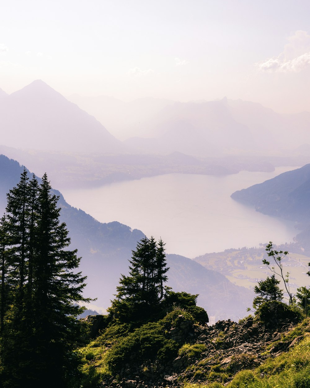 a view of a mountain range with a body of water in the distance