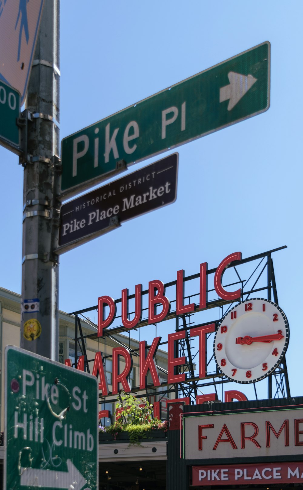 a street sign with a clock on top of it