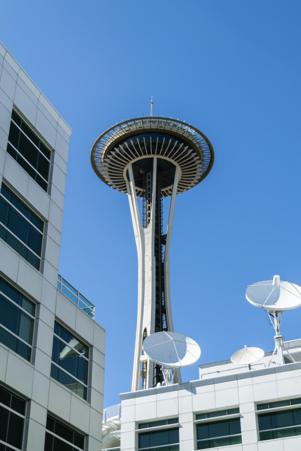 a very tall building with a very tall tower in the background