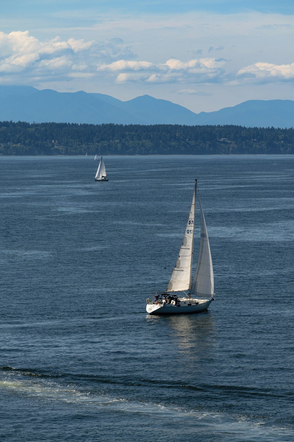 a sailboat in the middle of a body of water