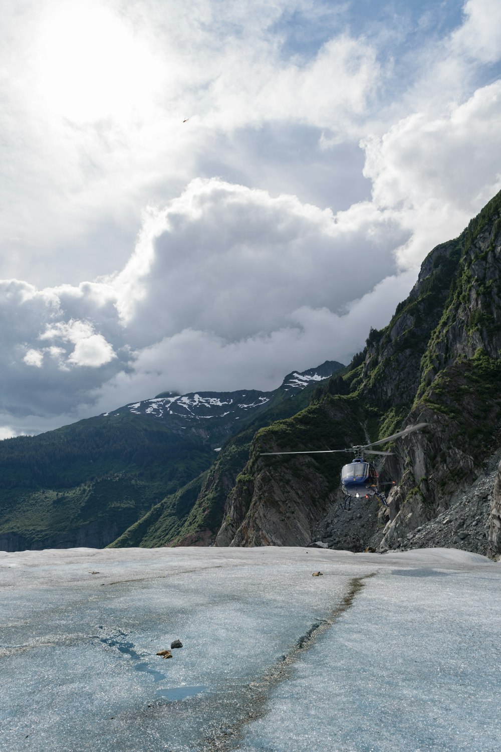 a cable car going up the side of a mountain