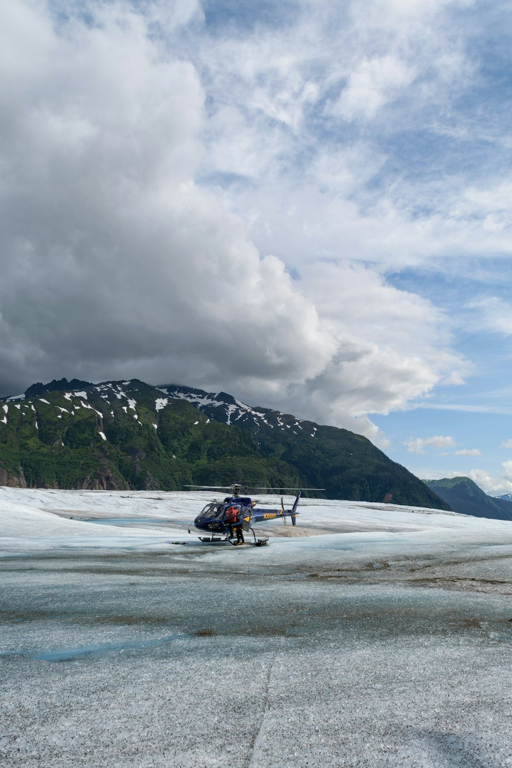 a small plane is parked on the snow