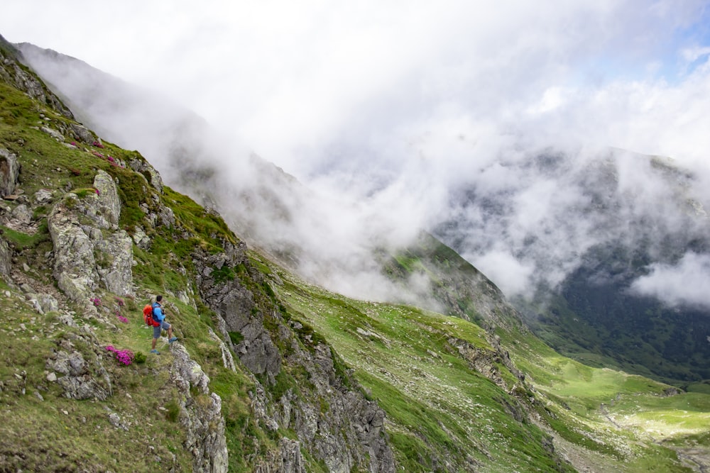 a group of people hiking up the side of a mountain