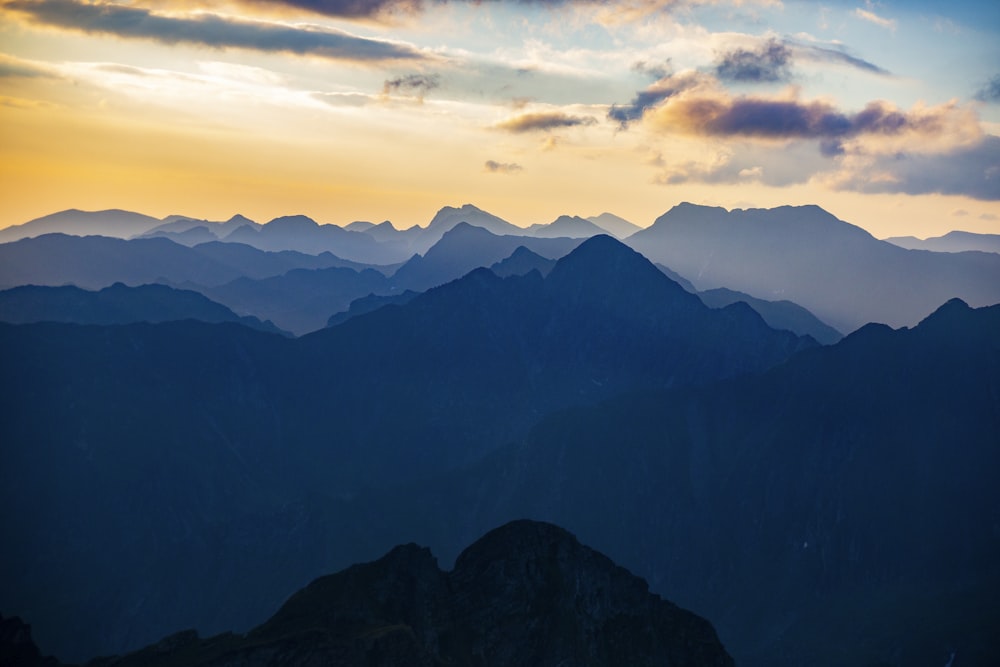 a view of a mountain range at sunset