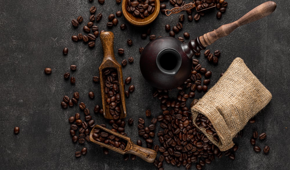 a table topped with lots of coffee beans