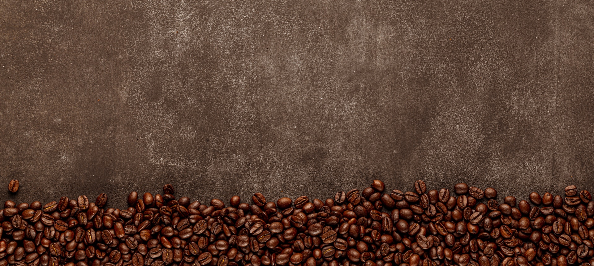 a group of coffee beans sitting on top of each other
