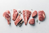 a group of raw meats on a table