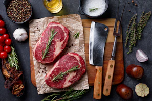 Selection of Wagyu cuts alongside fresh herbs ready for cooking