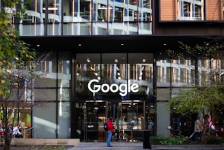 a man standing in front of a google building