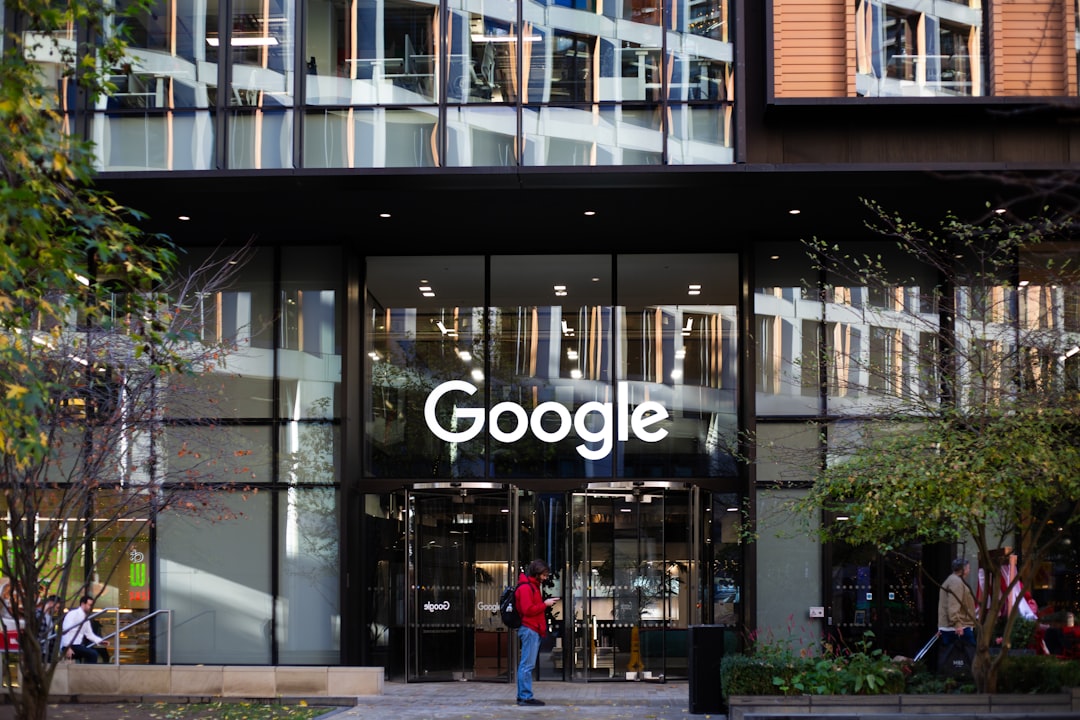 a man standing in front of a google building